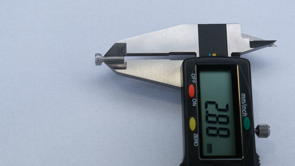 Digital caliper measuring the major diameter of an M3 A2 stainless socket head screw at 2.90 mm