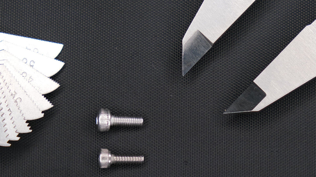 M3 and #4-40 socket head screws photographed side by side to compare their thread spacing