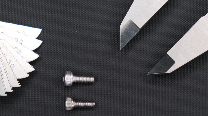 M3 and #4-40 socket head screws photographed side by side to compare their thread spacing