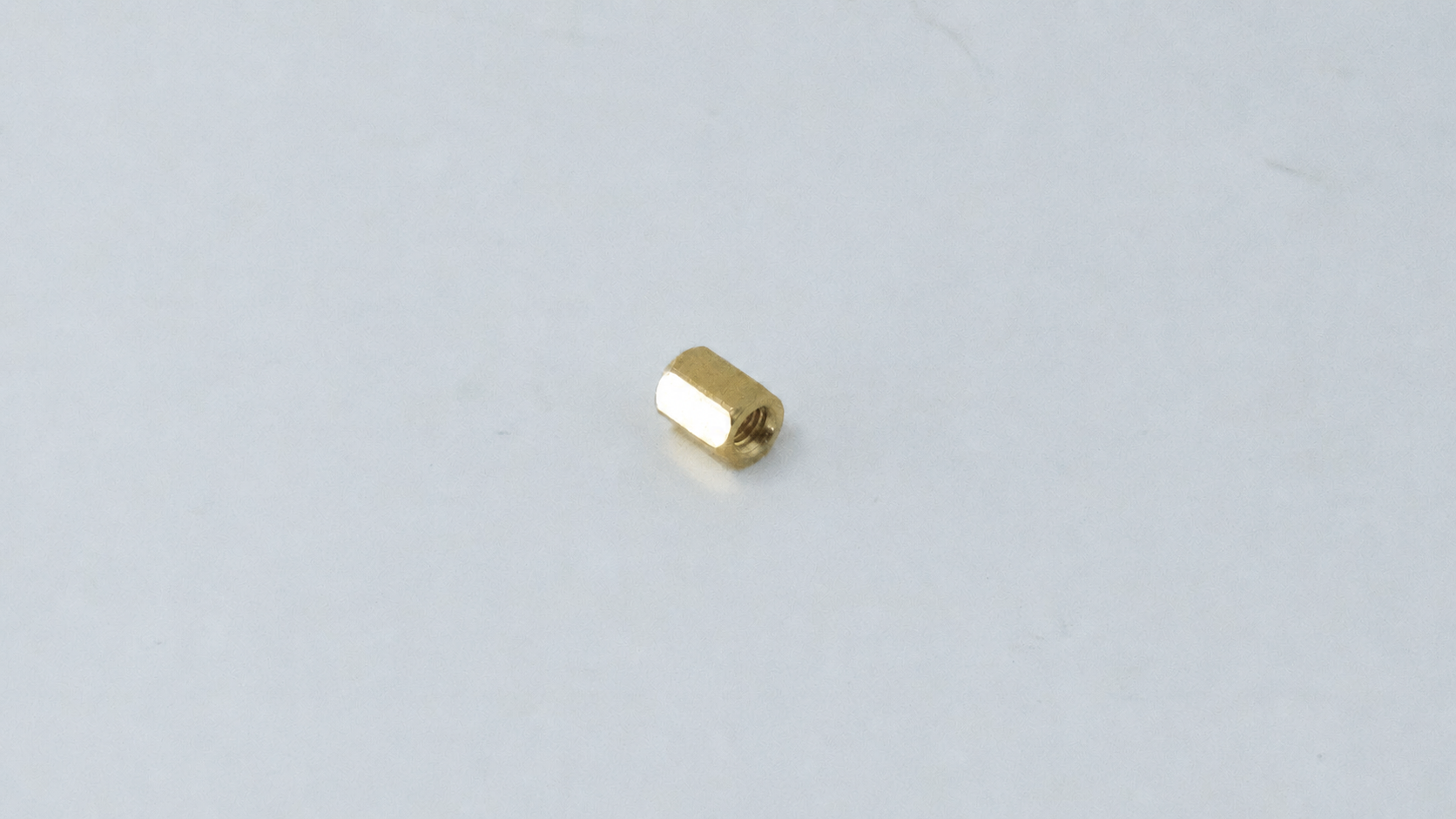 M3 Brass Hex Standoff, Female-Female, 15mm — representative natural brass female-female standoff on original background