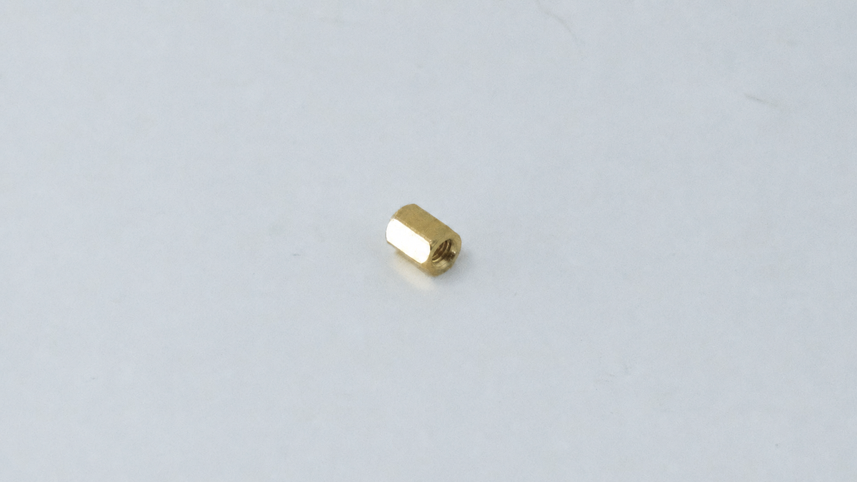 M2.5 Brass Hex Standoff, Female-Female, 15mm — representative natural brass female-female standoff on original background
